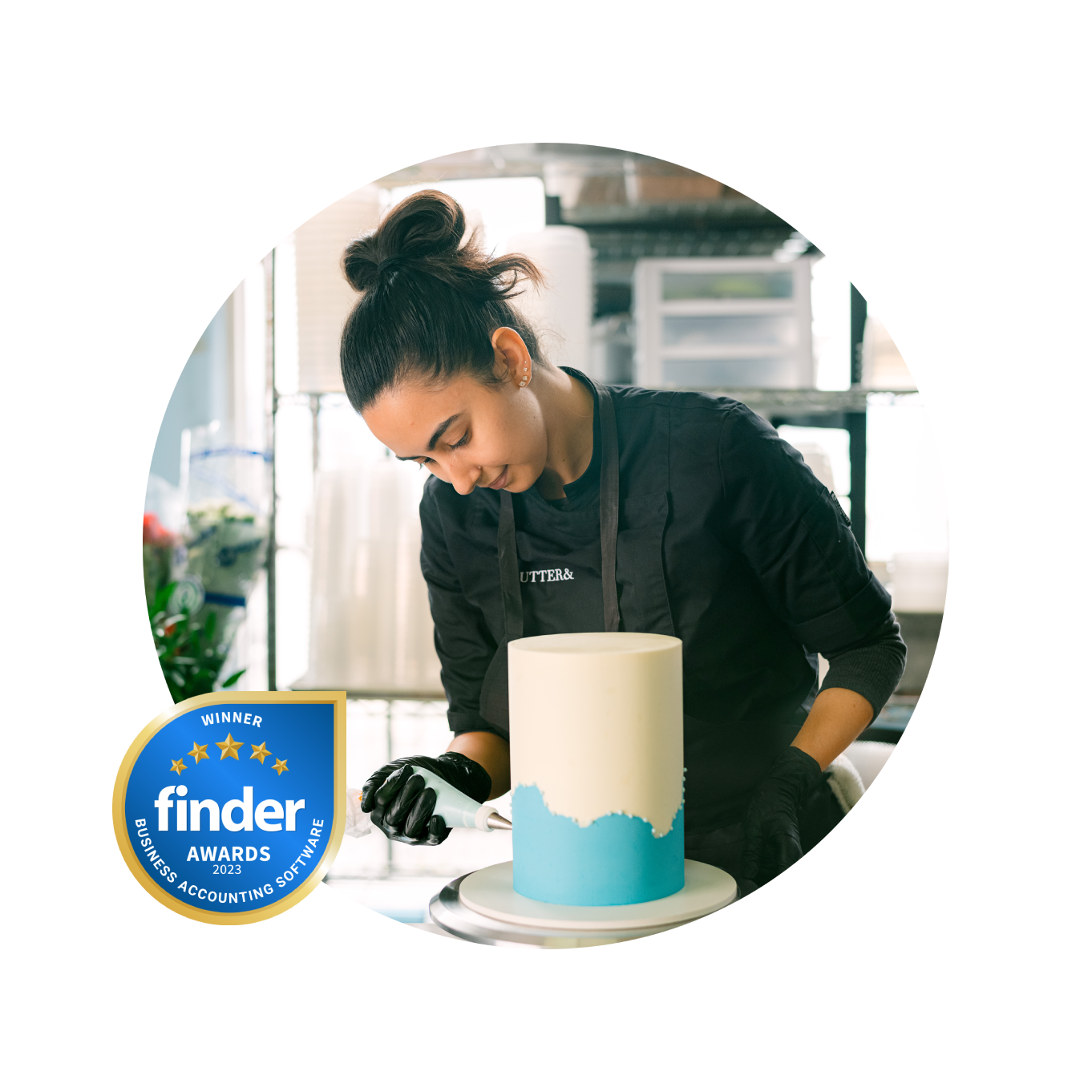 A Xero user decorating a cake with blue icing. Social proof award badge on the corner of the image.